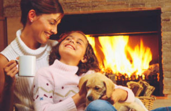 Mother and Daughter by Fireplace